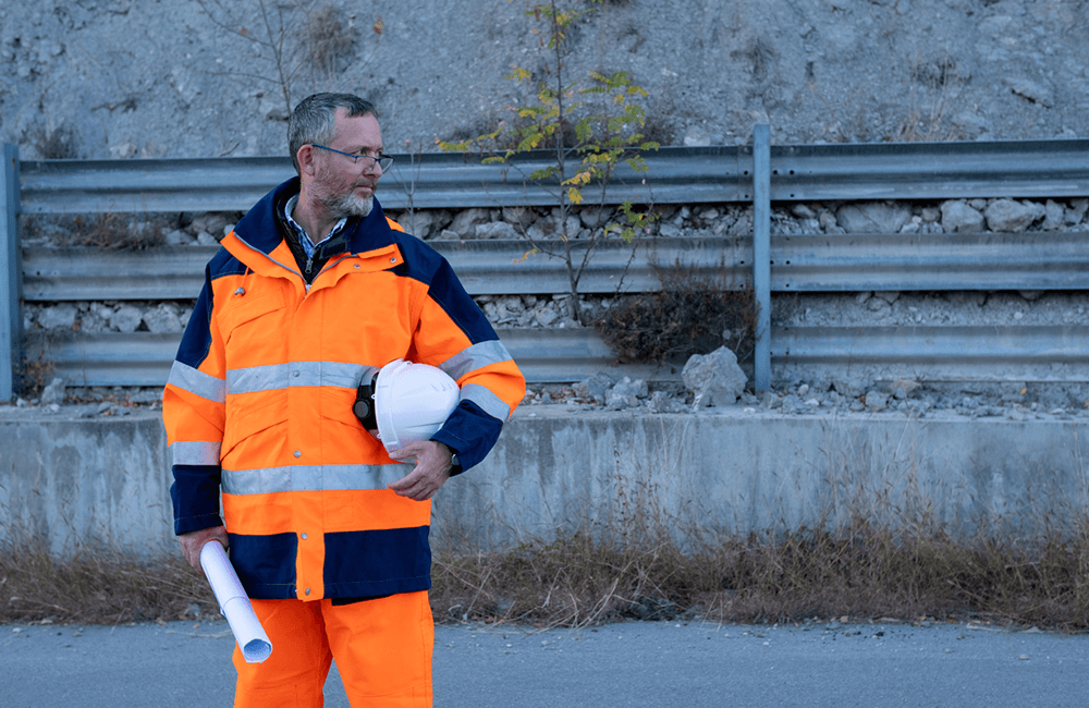 engineer wearing orange hi vis